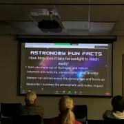  Photo from Navajo Astronomy. Screen shows a slide of Astronomy Fun Facts.