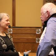 Elizabeth Skewes speaks with a patron. 