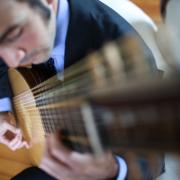 Man strumming guitar