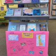 Photograph of display of books titled "Where the heck is Delaware?"