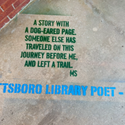 Photograph of a poem painted on the sidewalk. Pottsboro Library Poet - 2023.