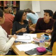 Students talking at a table