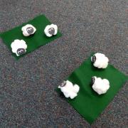 Small felt sheep on mini golf course