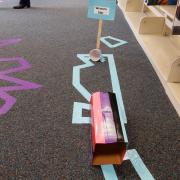 Mini golf course on library floor