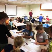 A group of children working at desks