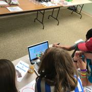 Four children on a laptop computer