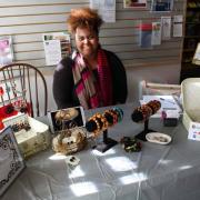 A vendor selling her crafts