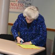 Senior works on one of the pillows