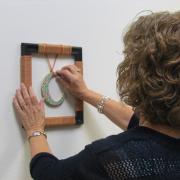 One participant puts the final touches on her initial frame.