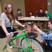 Participant on the smoothie blender bike