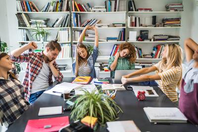 students stretching while studying