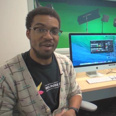 Orlando Public Library employee in front of computer monitor - shot from video