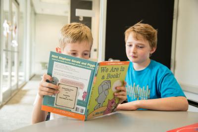 Two buddies reading together