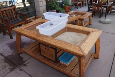 A wooden table designed for playing with water