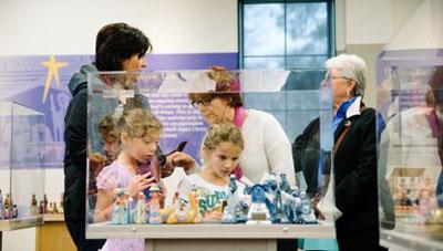 Family looking at Nativity