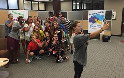 Participants pose for a photograph at one of the Roeschella photo booth stations.