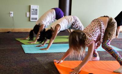 Children in downward dog pose